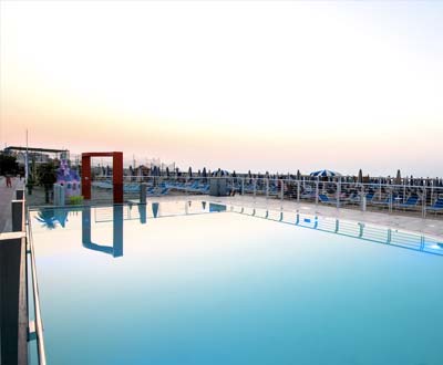Swimming pool at the beach in the evening